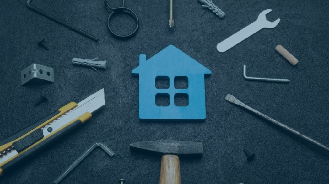 House icon with tools around it